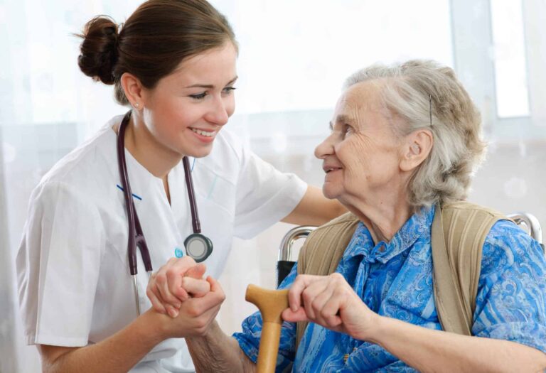 Senior woman with her home caregiver